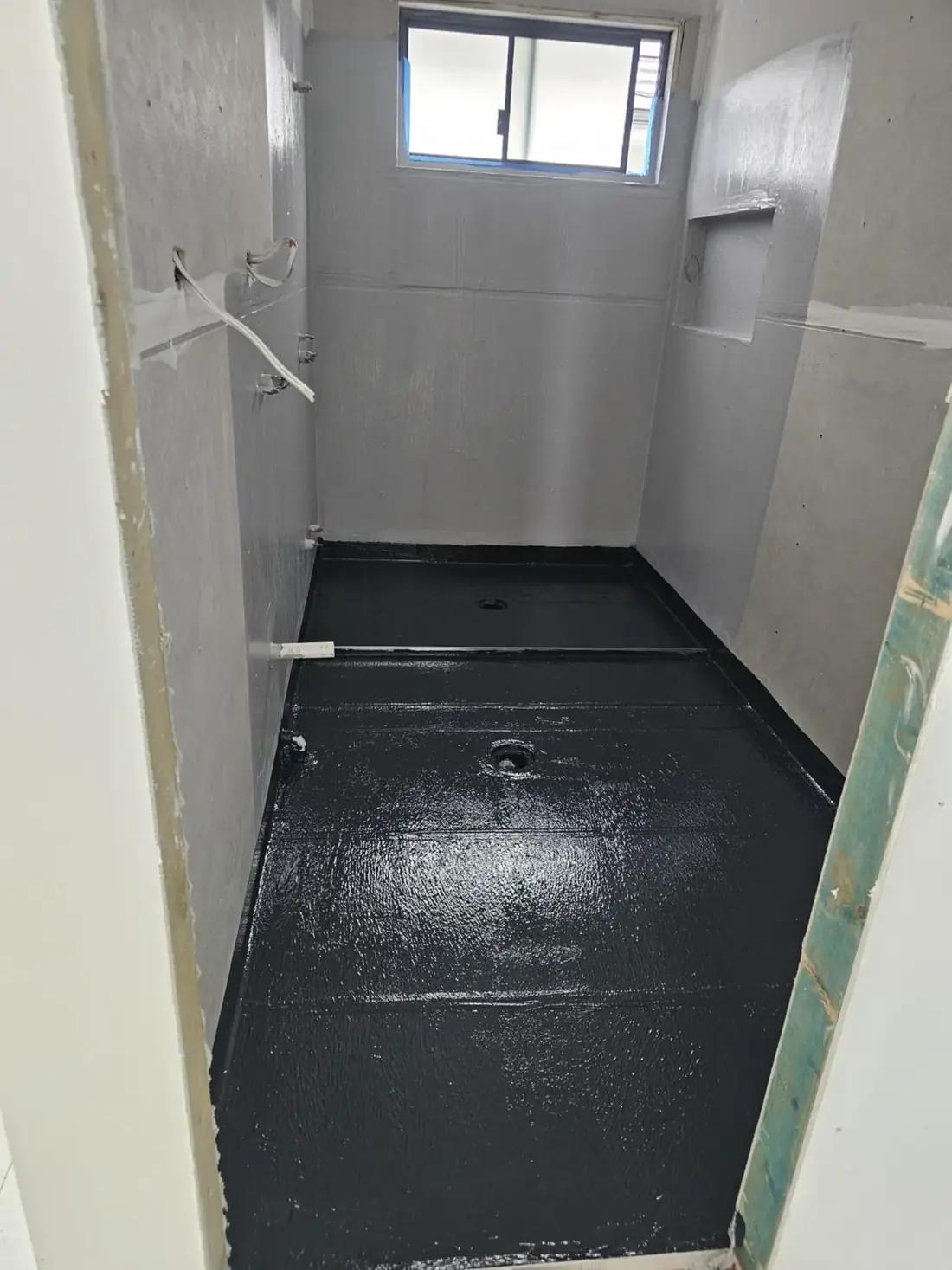 Bathroom waterproofing in progress